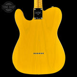 Yellow electric guitar body with brand logo on a black background