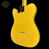 Yellow electric guitar body with 'Tone Shop' logo in the corner.