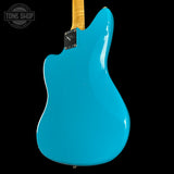 Blue electric guitar with a black background