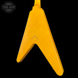 Yellow guitar pickguard on a black background with 'Tone Shop' logo.