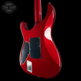 Red electric guitar on a black background with 'Tone Shop' logo.