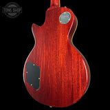 Red electric guitar body with Fender logo on a black background