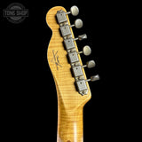 Guitar headstock with tuning pegs on a black background, featuring the Tone Shop logo.