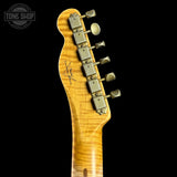 Guitar headstock with tuning pegs on a black background, featuring 'Tone Shop' logo.