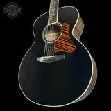 Front angle of Collings SJ Custom Jet Black Top Tigerstripe Pickguard Old Growth Sitka/Bastogne Walnut.