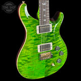 Green electric guitar with a clear finish on a black background, featuring the 'Tone Shop' logo.