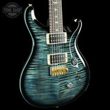 Blue electric guitar with a black background