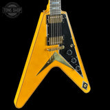 Yellow electric guitar with black pickguard on a black background, featuring 'Tone Shop' logo.