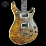 Wooden electric guitar with a visible brand logo in the corner