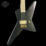 Black glitter electric guitar with gold hardware on a black background, featuring 'Tone Shop' logo.