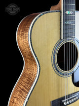 Front angle of Martin Custom Shop OM 45 Style Adirondack/Exceptional Broad Figure Koa.