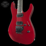 Red electric guitar on a black background with 'Tone Shop' logo.