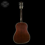 Acoustic guitar on a black background with 'Tone Shop' logo.