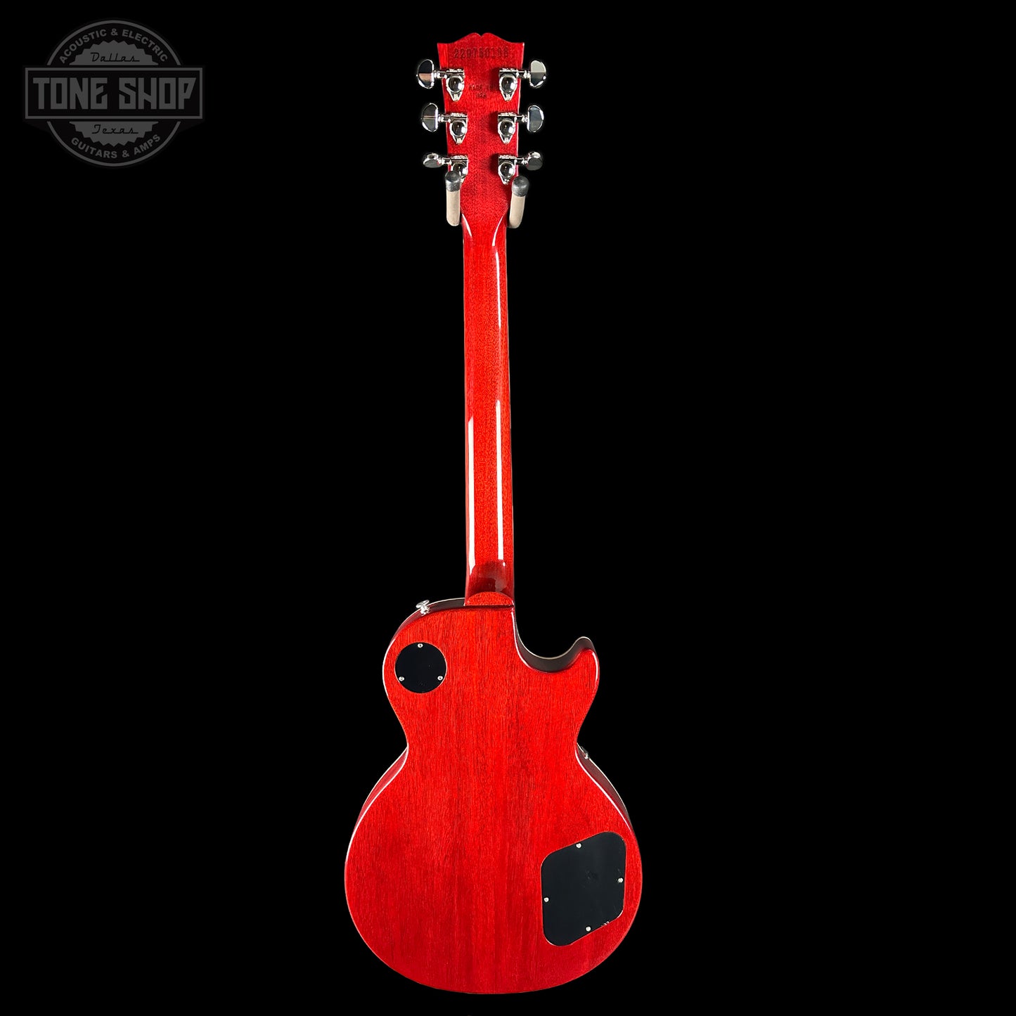 Red electric guitar on a black background with 'Tone Shop' logo.