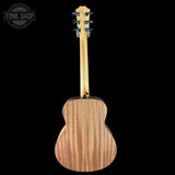 Back view of a wooden acoustic guitar with 'Tone Shop' logo in the corner.