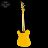 Yellow electric guitar on a black background with 'Tone Shop' logo.