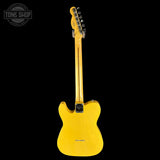 Yellow electric guitar with a black background
