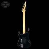 Black electric guitar with a visible brand logo on a white background
