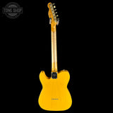 Yellow electric guitar on a black background with 'Tone Shop' logo.