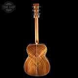 Back view of a wooden acoustic guitar