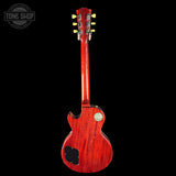 Red electric guitar on a black background with 'Tone Shop' logo.