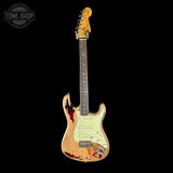 Distressed electric guitar with visible wear on a black background, featuring 'Tone Shop' logo.