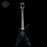 Black electric guitar on a white background with 'Tone Shop' logo.