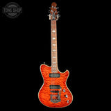 Electric guitar with a red flame finish on a black background, featuring the Tone Shop logo.