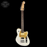 Electric guitar with a white body and gold accents on a black background, featuring the Tone Shop logo.