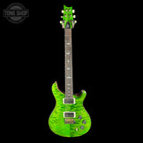Green electric guitar on a black background with 'Tone Shop' logo.