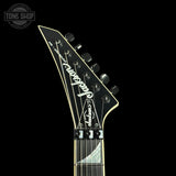Guitar headstock with 'Jackson' branding on a black background