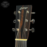 Collings guitar headstock with brand logo on a black background