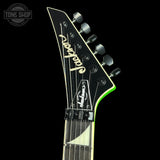 Guitar headstock with 'Jackson' branding on a black background