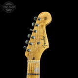 Close-up of a Fender guitar headstock on a black background