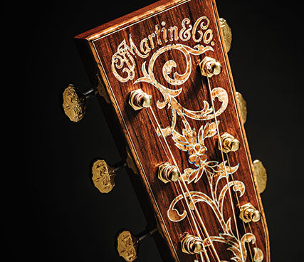 Elaborate Martin Guitar inlayed logo on headstock at Tone Shop Guitars DFW
