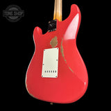 Back angle of Fender Custom Shop Time Machine '57 Strat Heavy Relic Aged Fiesta Red.