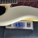 Used Partscaster Mighty Mite, Hipshot, Seymour Duncan on scale displaying weight.