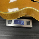Vintage 1959 Gibson Byrdland Natural on scale displaying weight.