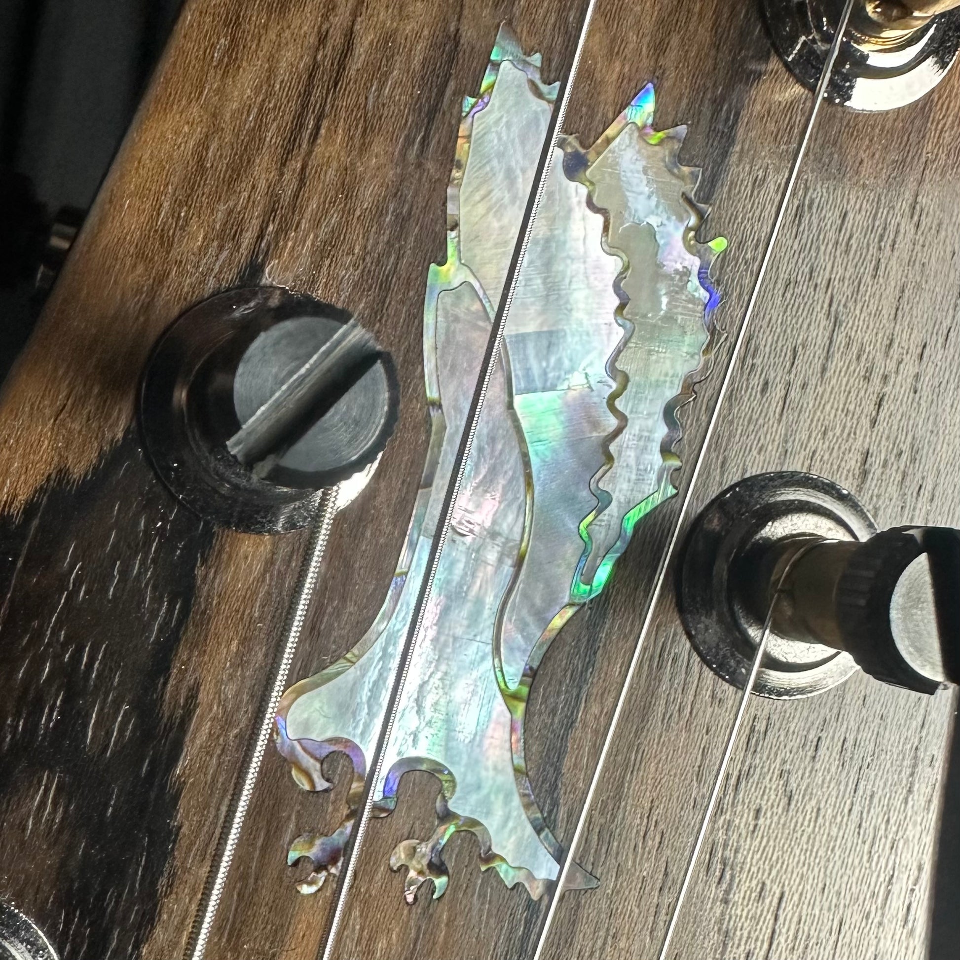 Closeup of headstock of PRS Private Stock Special Semi-hollow Limited Edition Citrus Glow.