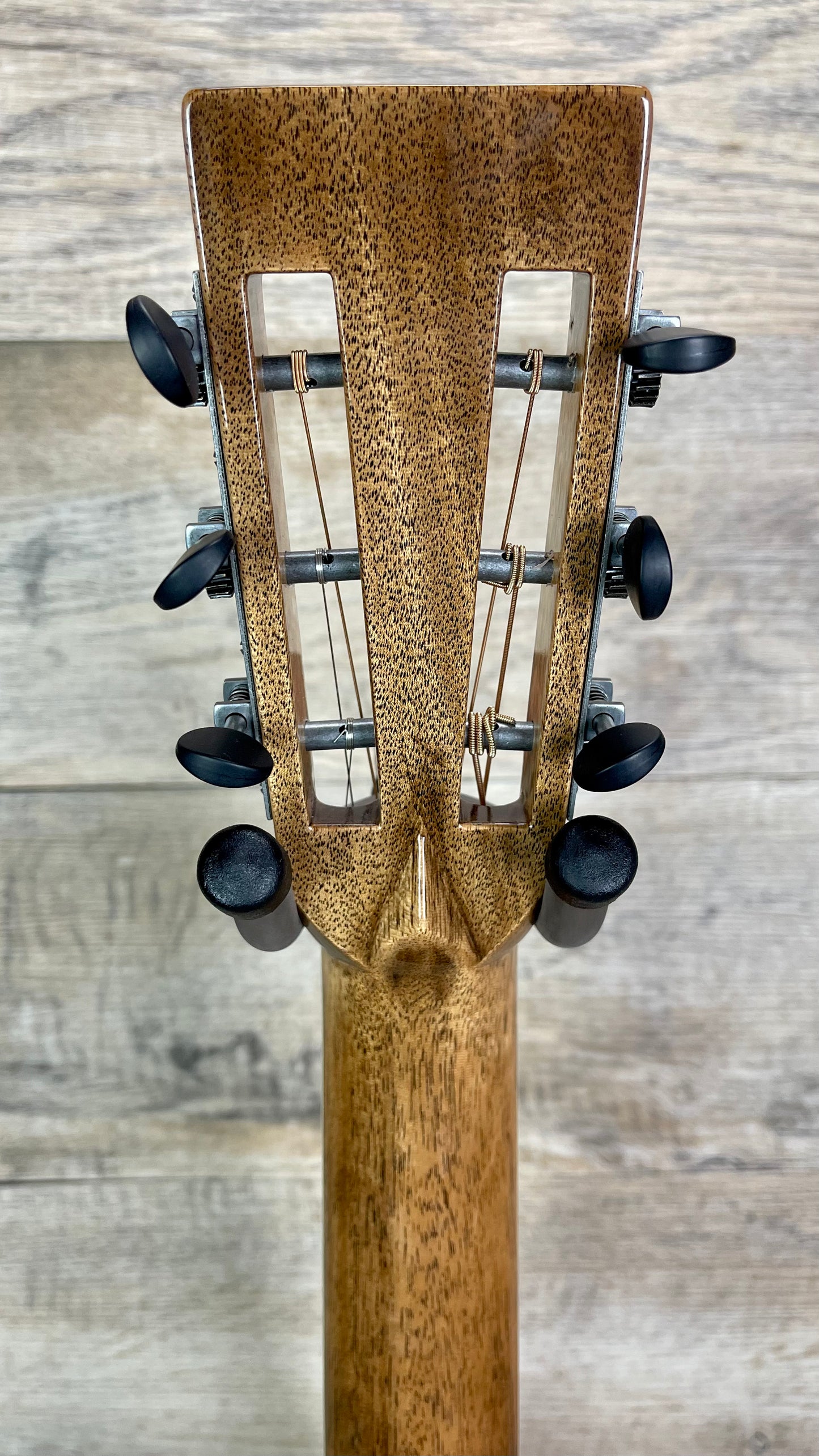 Back of headstock of Martin Custom Shop 42 Style 000 12-Fret All Highly Flamed Koa.