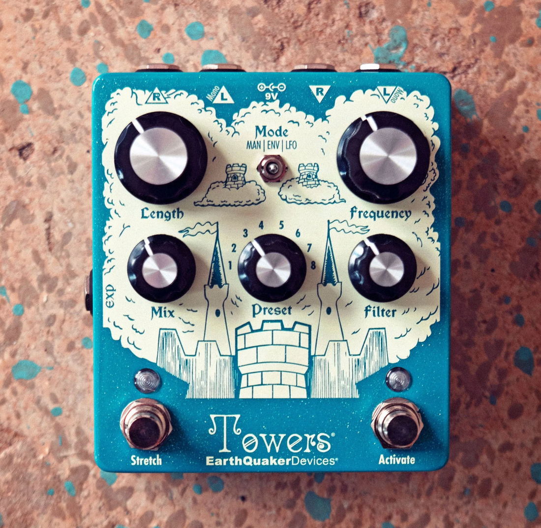 Blue and white Towers pedal on brass background. 