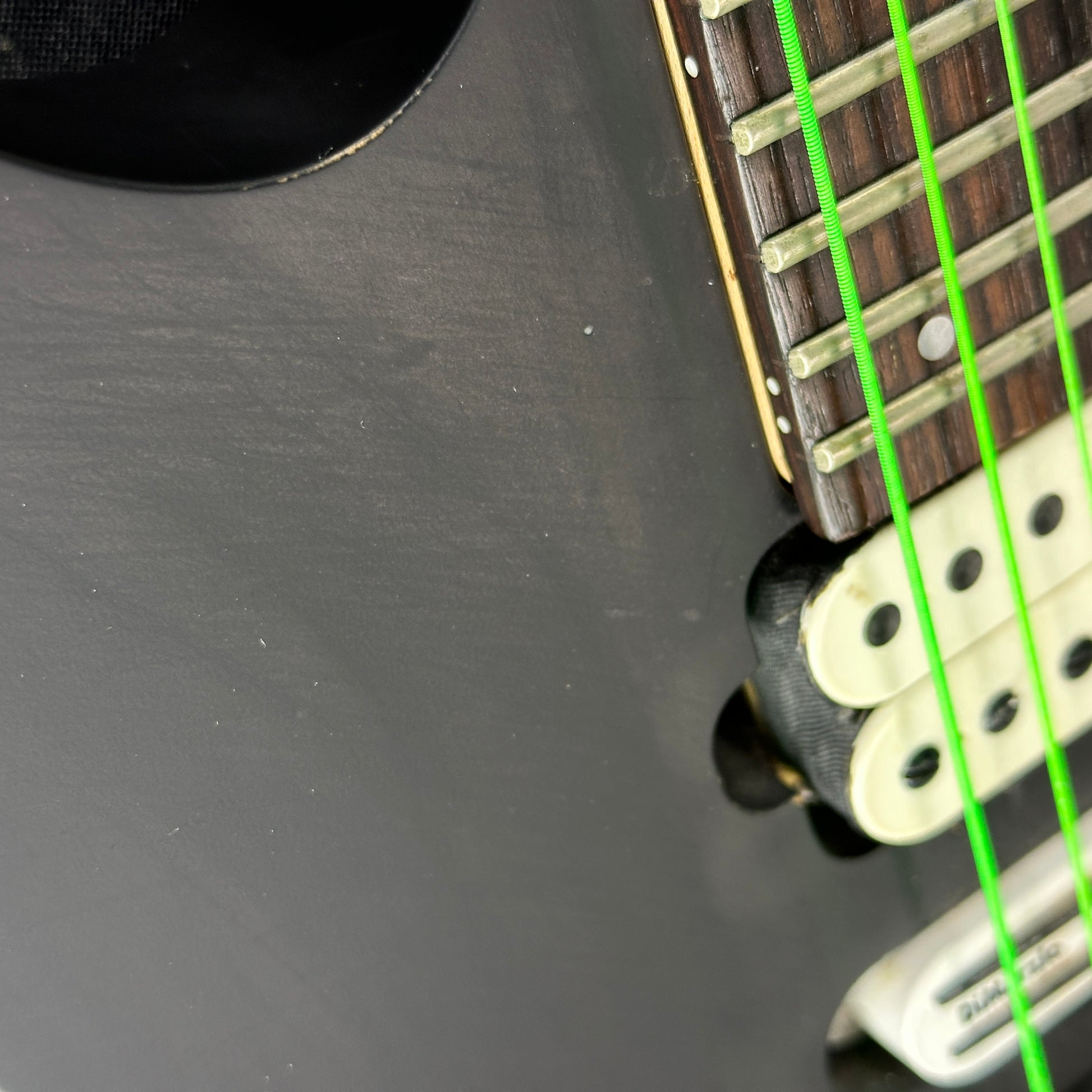 Scratches on body of Used Ibanez Prestige RG157OR Suede Black.