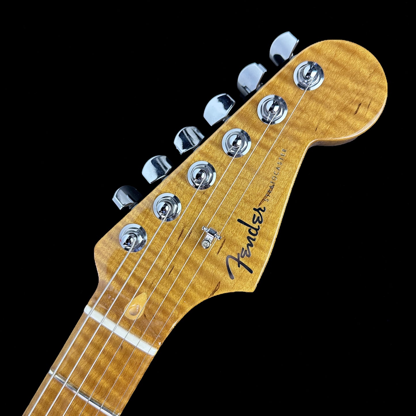 Front of headstock of Used Fender Custom Shop Stratocaster NOS Honey Blonde.