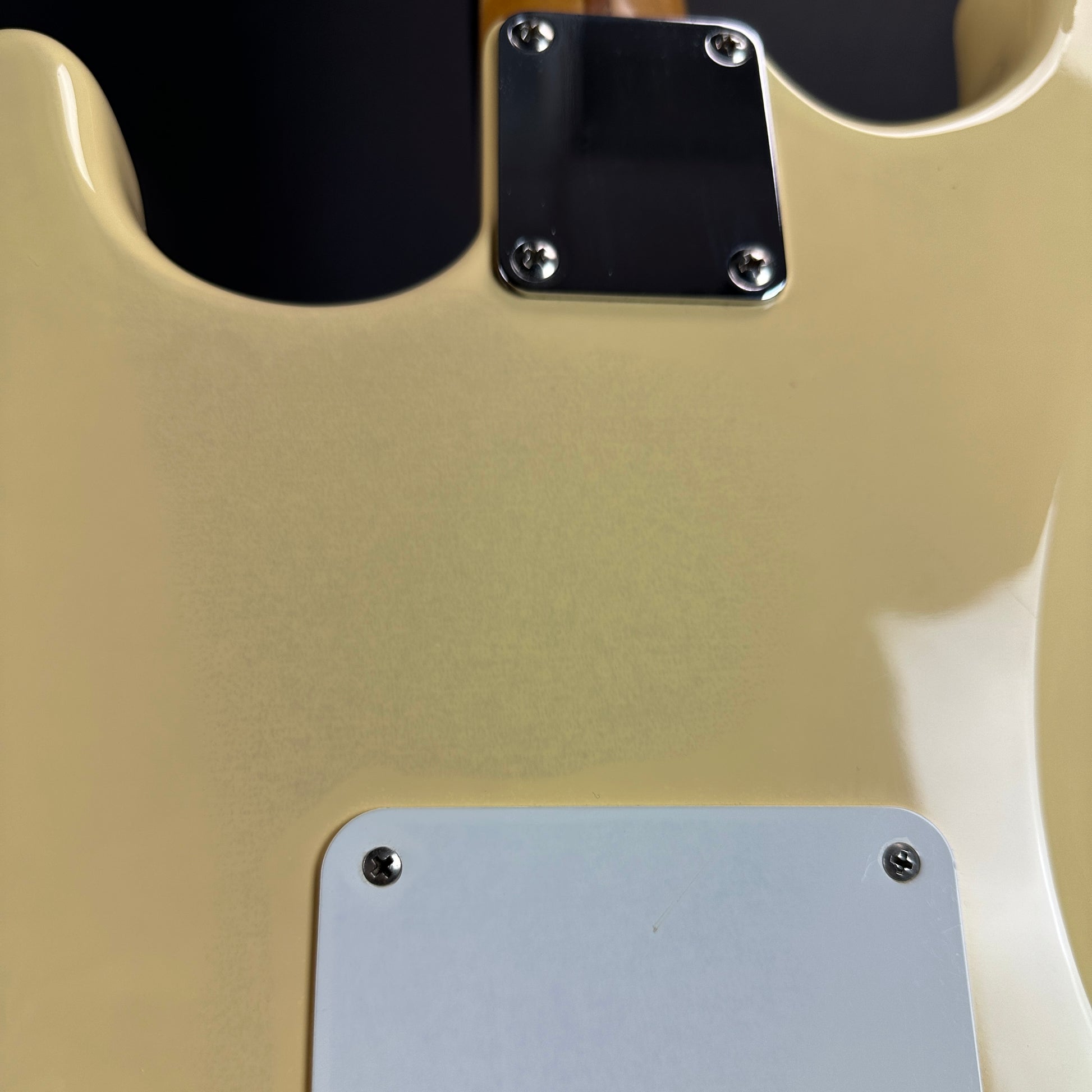 Discoloration on back of Used Fender Standard Strat MIM White.