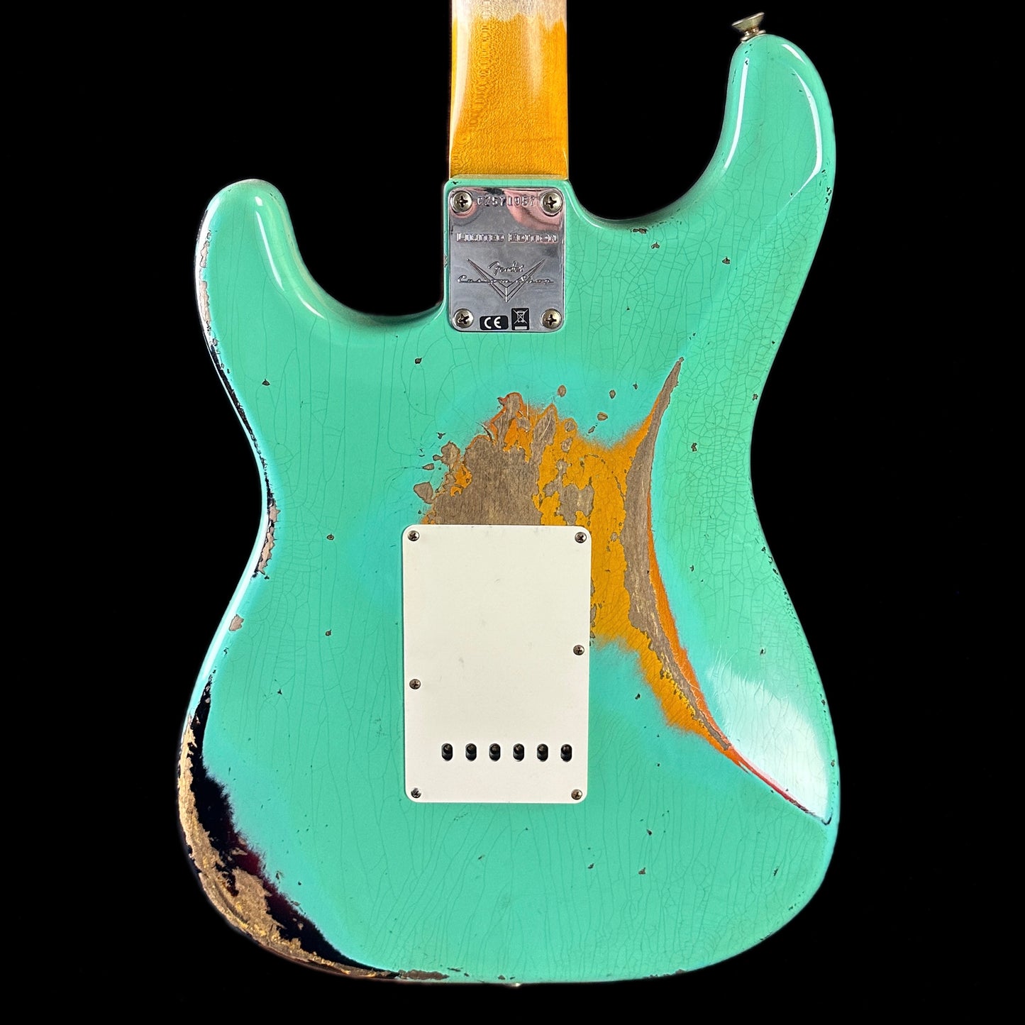 Back of body of Fender Custom Shop Limited Edition '62 Strat Heavy Relic Faded Aged Sea Foam Green Over 3 Color Sunburst.