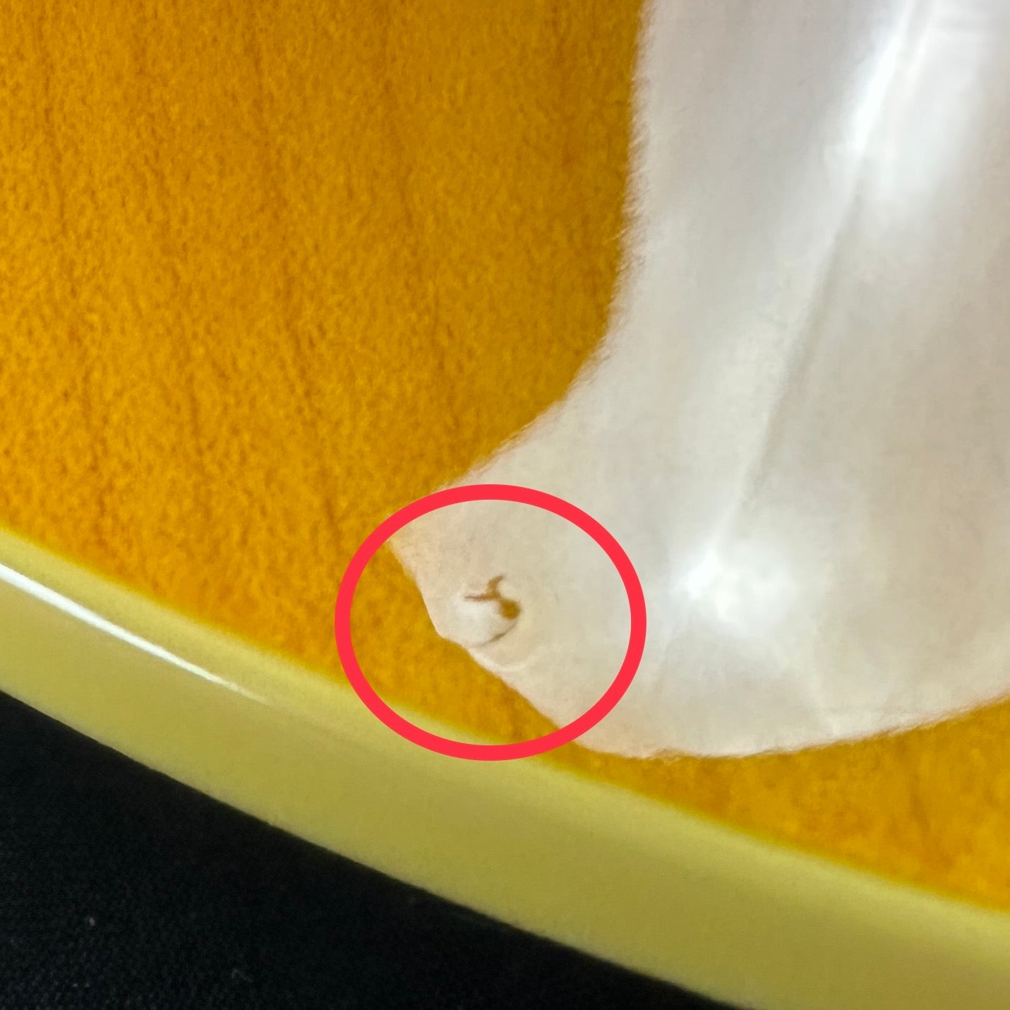 Small ding on front of body near the bottom.