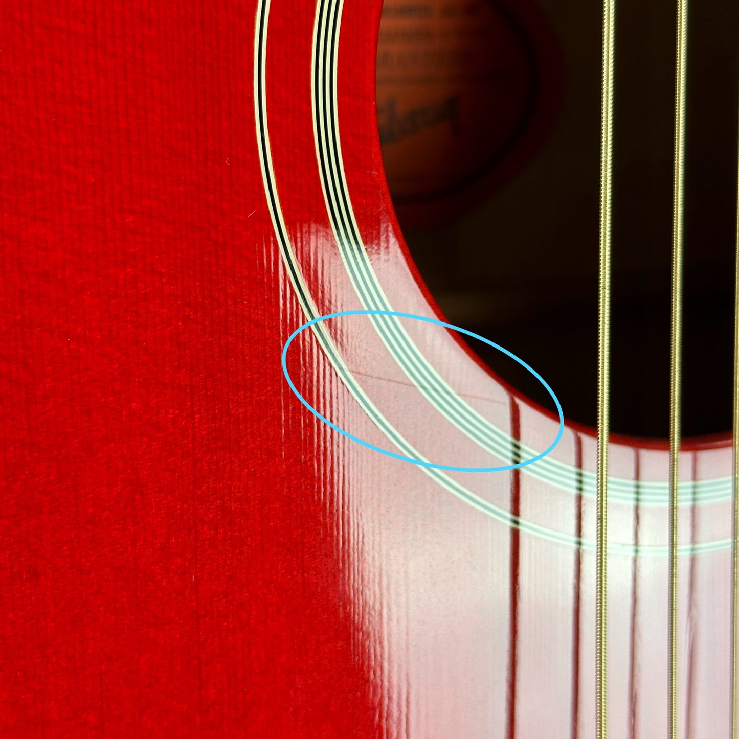 Scratch n ear pickguard of Used 2021 Gibson Orianthi SJ-200 Trans Red.