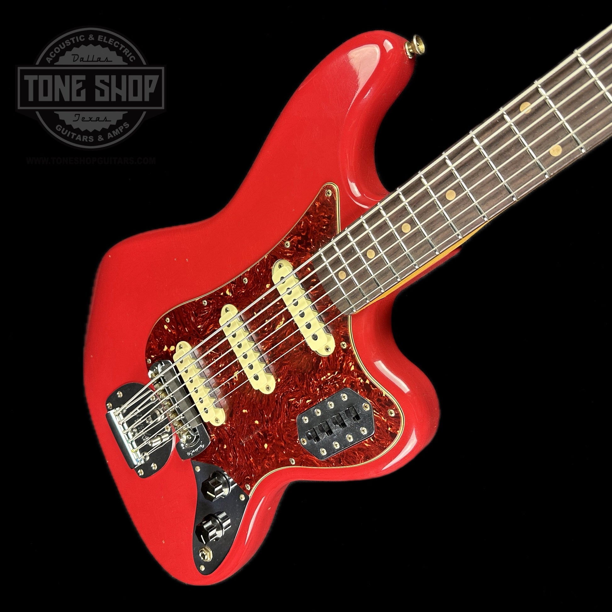 Front angle of Fender Custom Shop Limited Edition Bass VI Journeyman Relic Aged Dakota Red.