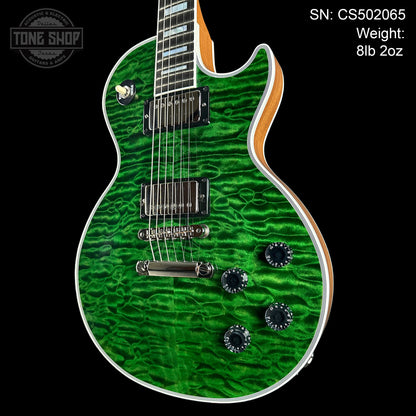 Front angle of Gibson Custom Shop TSG Anniversary Les Paul Custom Chambered 7A Quilt Trans Green.