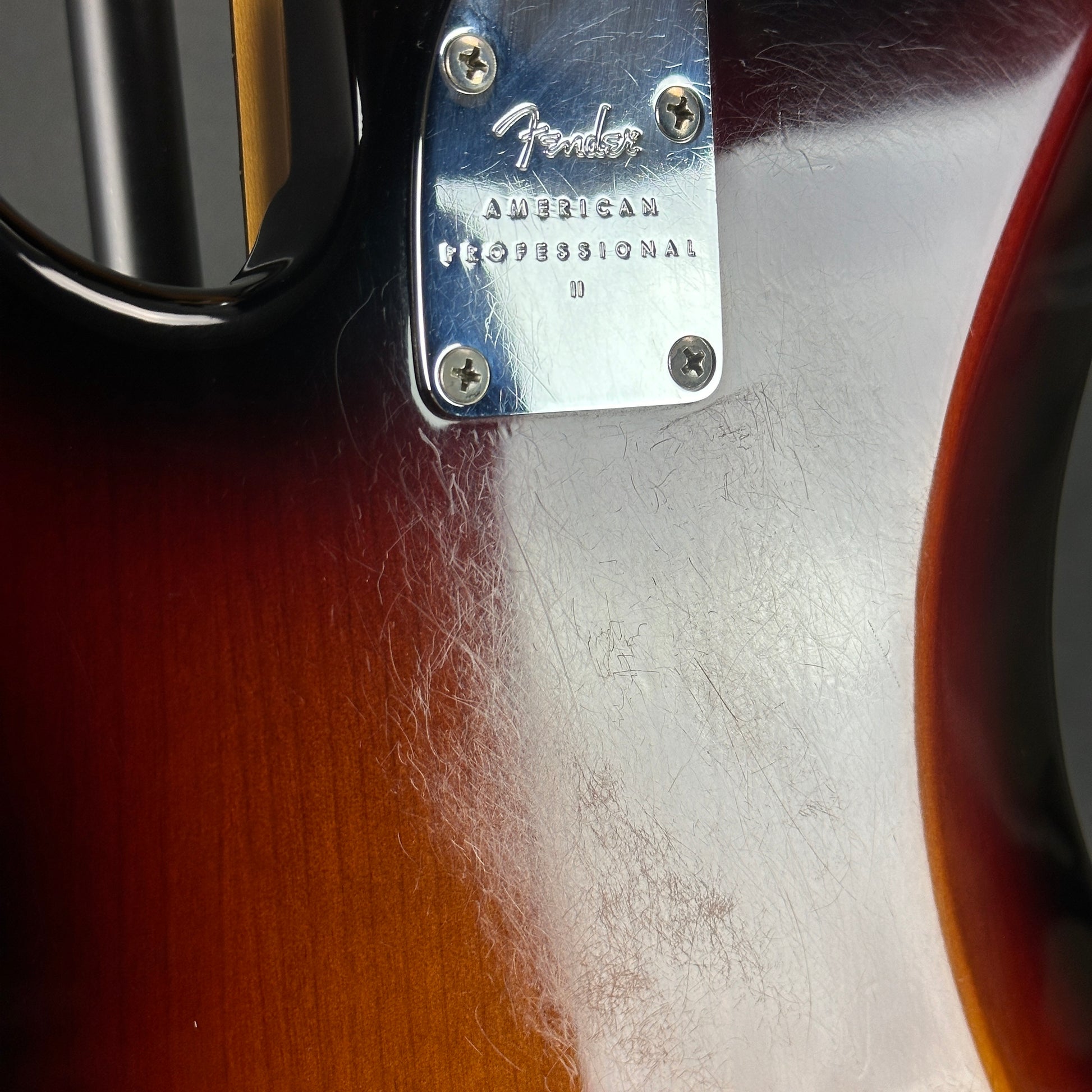 Scratches on back of Used 2021 Fender American Pro II Precision Bass Sunburst.